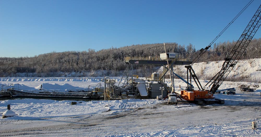 Alaskan gold dredge with construction camera