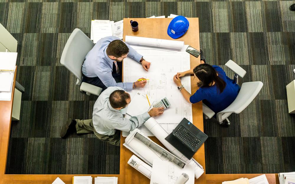 Construction professionals reviewing marketing plans