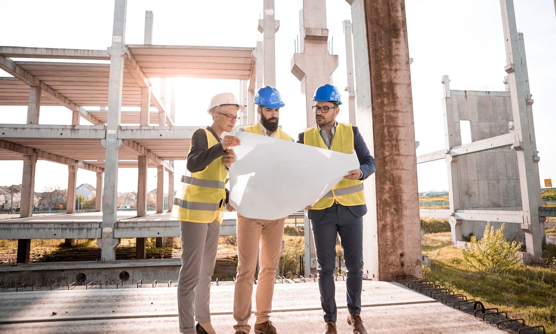 Construction professionals reviewing project plans